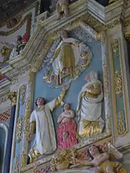 In the tableau in the centre of the altarpiece's upper section, Christ, surrounded by angels, receives the souls which Saint Dominic and Catherine of Sienna have rescued from the flames of purgatory