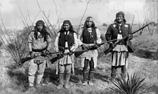 Geronimo, Yanozha (Geronimos's brother-in-law), Chappo (Geronimo's son by his second wife), and Fun (Yanozha's half brother) (right to left) in 1886.