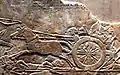 Assyrian soldiers rushing the head of Teumman to Nineveh.