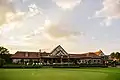 Back of the clubhouse from the practice putting green.