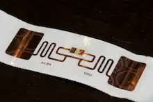 Back side of disposable RFID tag used for race timing showing components.