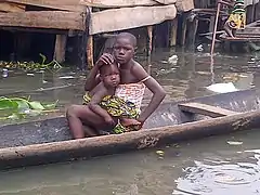 Makoko: A girl and her sister in a canoe