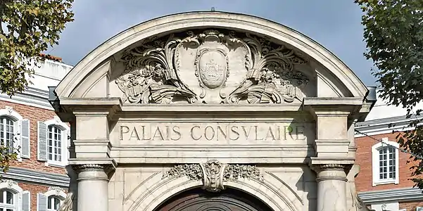 The pediment and coat of arms of the Chamber of Commerce and Industry.