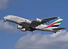 Ground to air photograph of an Emirates Airbus A380 departing London Heathrow Airport