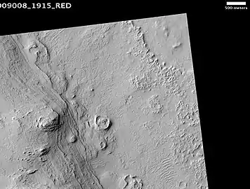 Henry Crater mound, as seen by HiRISE. The scale bar is 500 m (1,600 ft) long