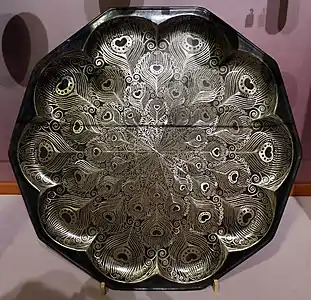 Jean Dunand, Peacock tray,  nickel and silver in a peacock feather design, (1914), Musée d'Orsay, Paris.