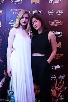 A photograph of filmmaker Julia Hart and actress Brit Marling on the red carpet of Fantastic Fest 2015