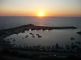 Port of Karaburun and the cape with the lighthouse (far left)
