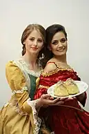 "Breast" Pastry, created by convent, displayed by models in period costume