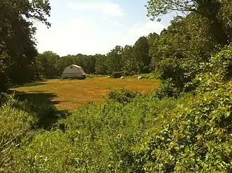 Narragansett Trail - "Shelter Cave Field" meadow with barn adjacent to "Trolley Pasture" meadow.