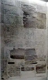 Fragments of reliefs interspersed with recent drawing showing the likely continuation of the damaged parts