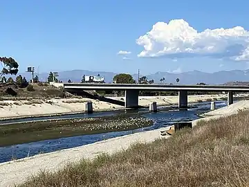 Rail bridge pylons remaining from Ballona Creek crossing of Venice–Inglewood Line; 90 freeway to the rear