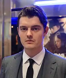 Head-and-shoulders colour photograph of Sam Riley in 2014
