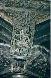 A carved bracket with an Idol in the roof