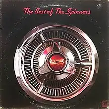 A red and chrome hubcap