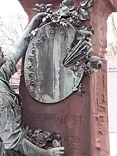 Beaux Arts cartouche as a painter's palette of the Grave of Gustave Jundt, Montparnasse Cemetery, Paris, by Frédéric Auguste Bartholdi, c.1884