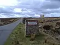 Signpost for Otterburn Crossroads on the MoD ranges