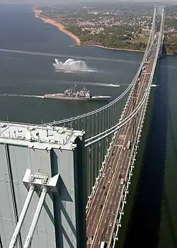 The Verrazzano-Narrows Bridge, shown with USS&nbsp;Leyte Gulf passing underneath it, spans The Narrows
